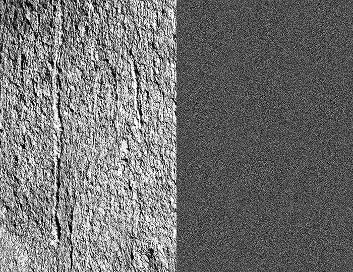 Photo in black and white depicting two nuances of gray. One being dark gray and the one being a lighter gray with stone texture.