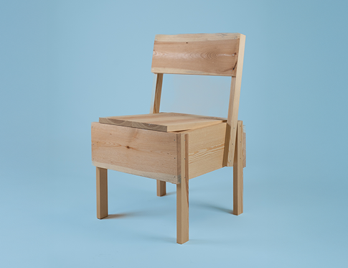 Photo. Wooden chair and a blue background.