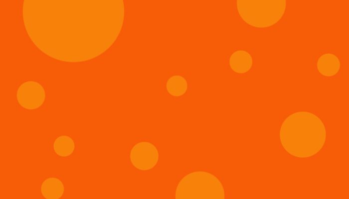 Orange bakgrund med brandgula prickar i olika storlekar