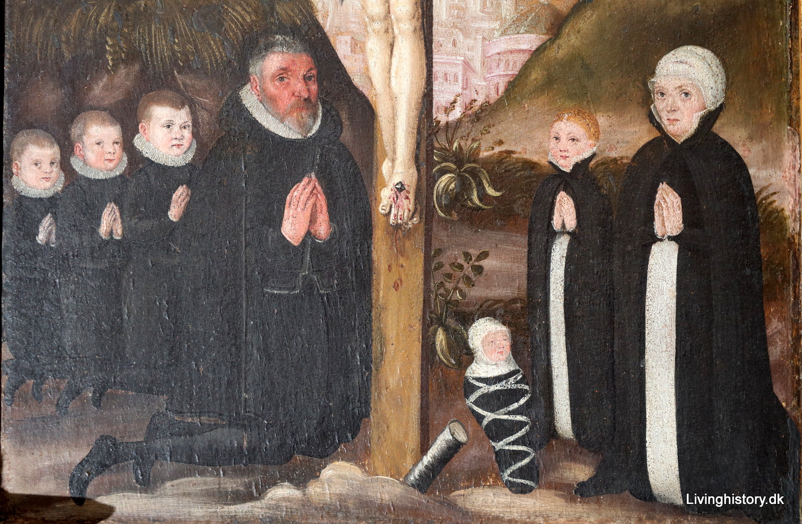 Målning. Gruppbild med en man och en kvinna samt fyra barn, varav ett är ett lindebarn. De står på knä med knäppta händer.